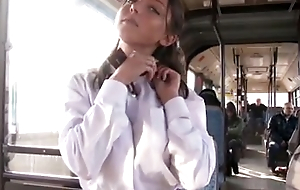 Pretty teen does blowjob on Japanese bus