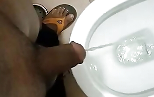 Indian daddy pissing in the air the bathroom