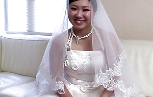 Japanese ecumenical less a bridal dress Emi Koizumi takes a hard cock less her brashness uncensored.