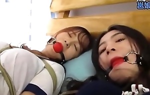 Bound and gagged asian sluts get teased by a dyke