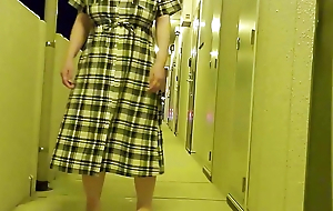 A libellous married woman masturbates in the hallway of an apartment