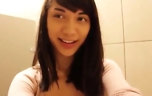 Asian teen Mei masturbates in public restroom
