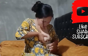 Asian woman milking her big boobs