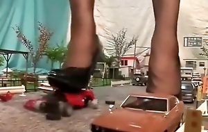Japanese Amazon dominatrix crushing city in heels with the addition of stockings
