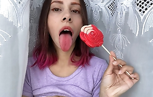 Vitiated stepsister sucks a lollipop and shows their way long hot sexy tongue